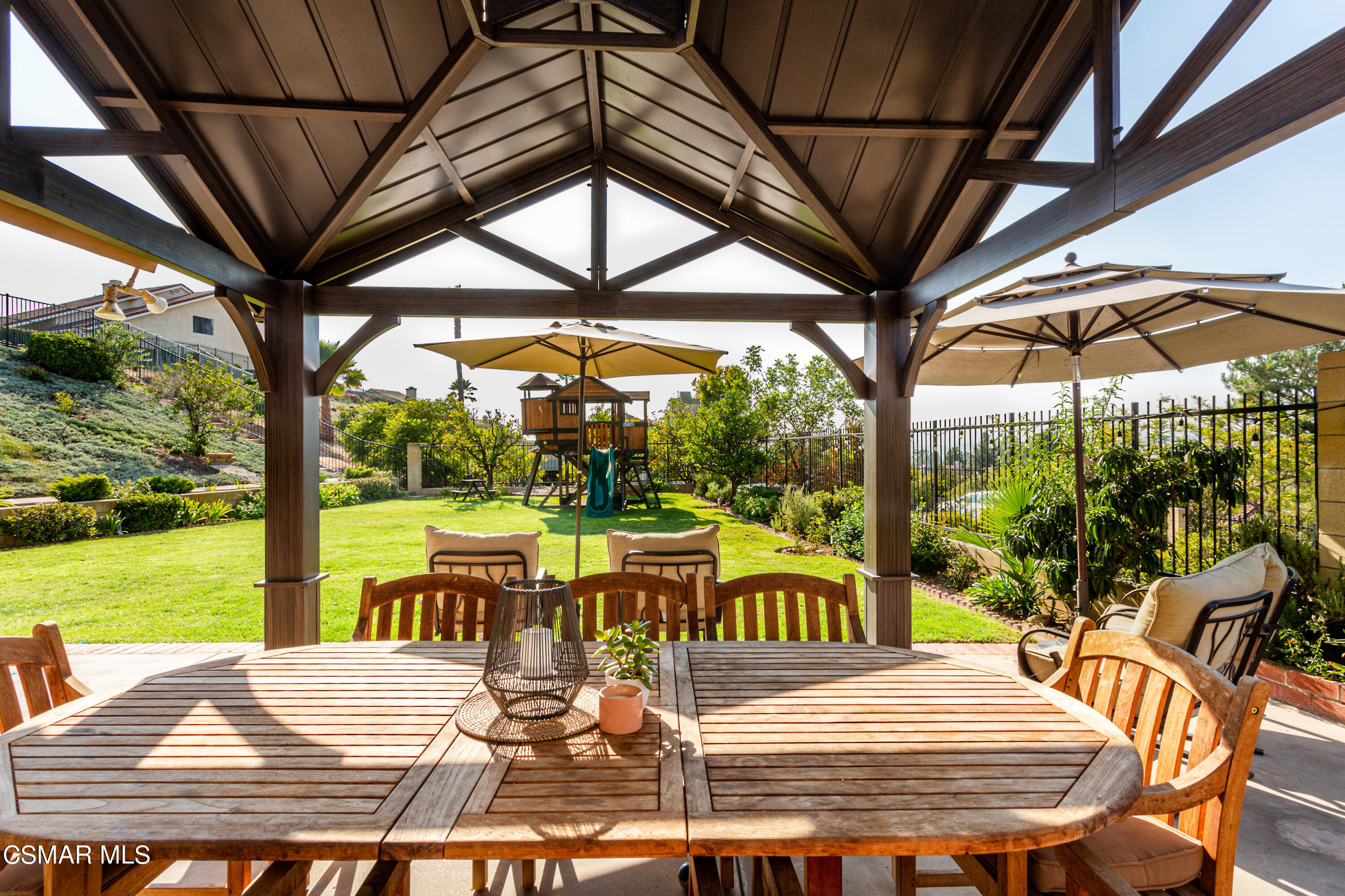 4249 Laurelhurst Road Moorpark, CA 93021 - Photo 22 of 30 a view of a patio with a table chairs and a patio