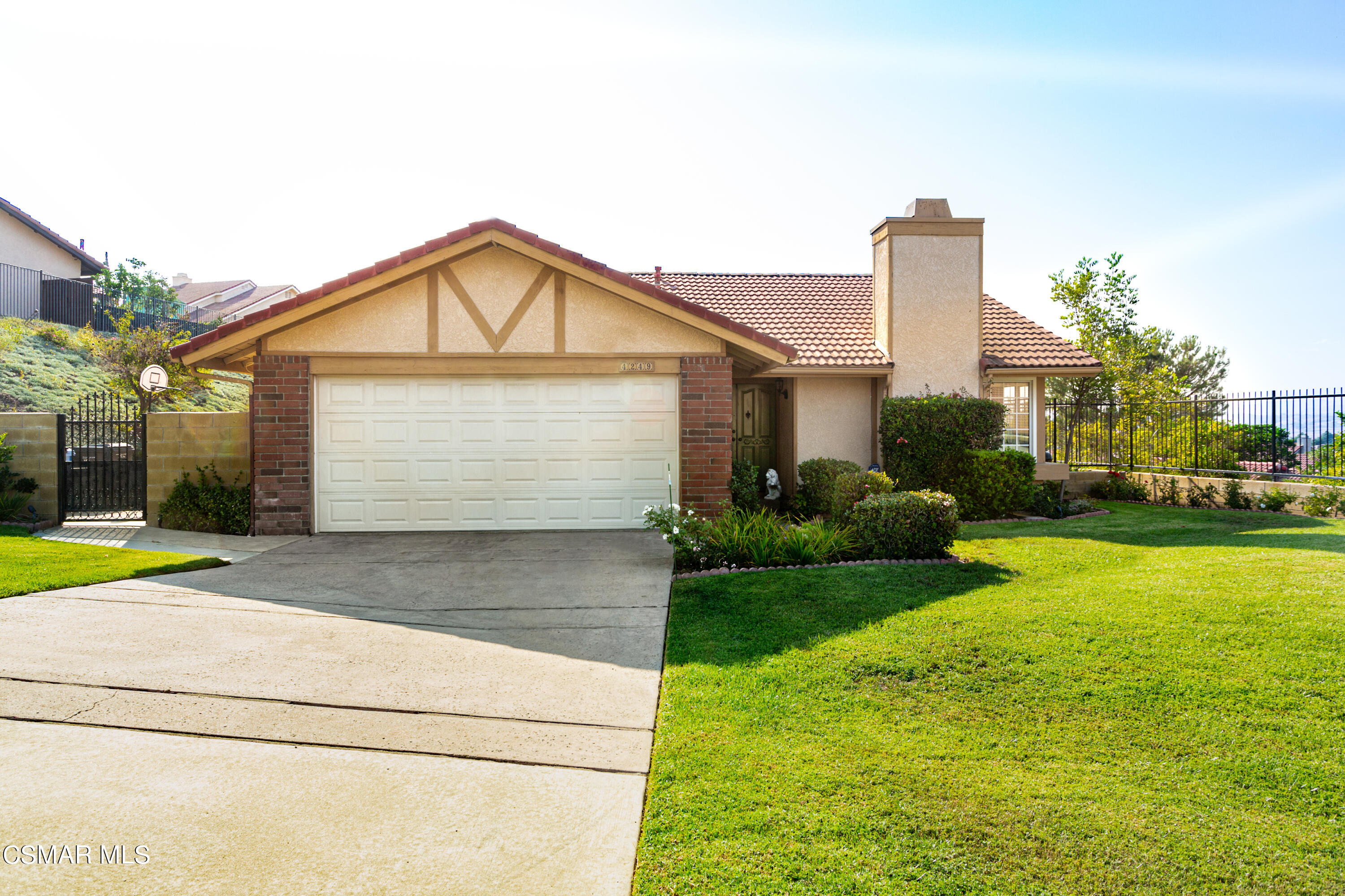 4249 Laurelhurst Road Moorpark, CA 93021 - Photo 4 of 30 a front view of a house with garden
