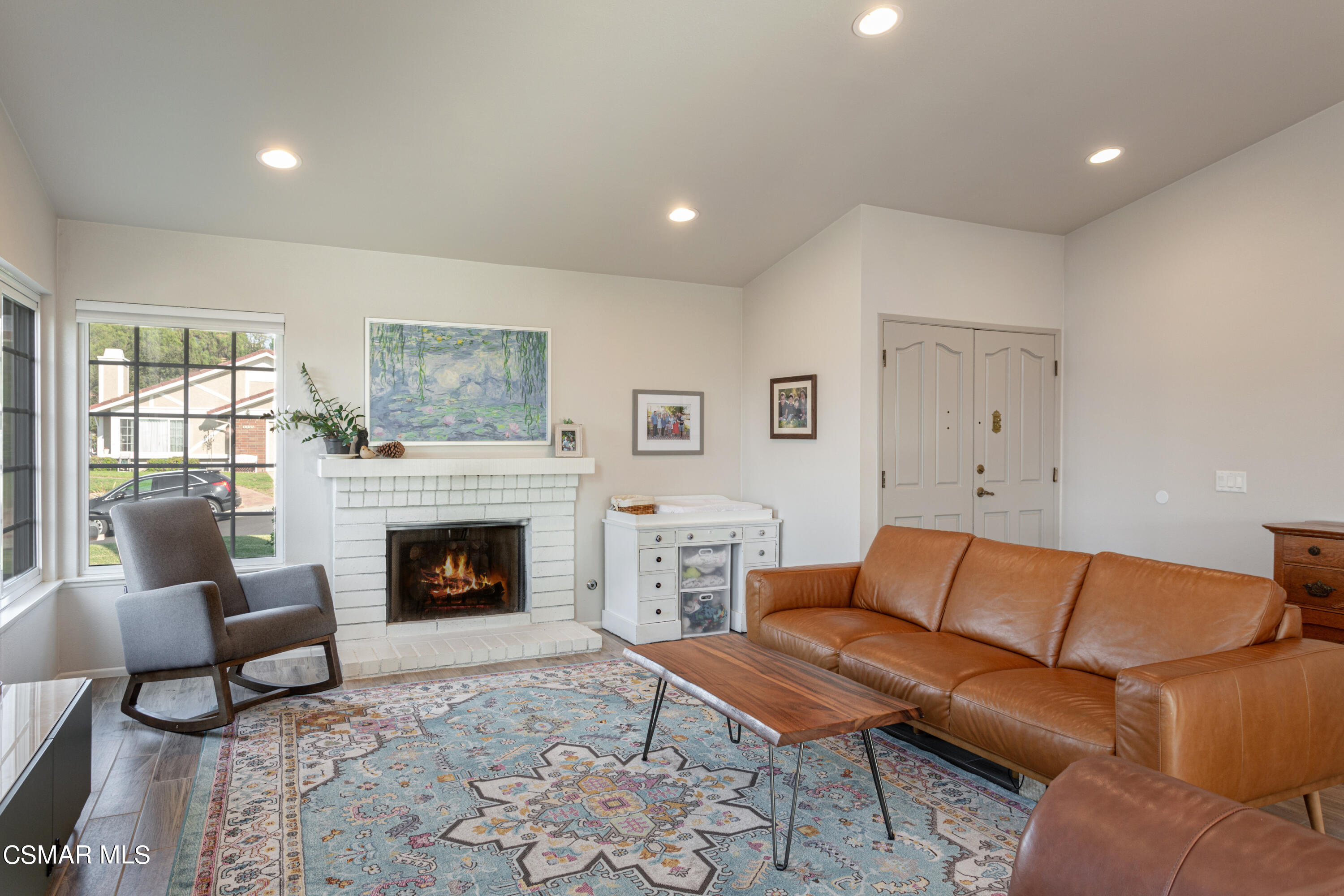 4249 Laurelhurst Road Moorpark, CA 93021 - Photo 8 of 30 a living room with furniture and a fireplace