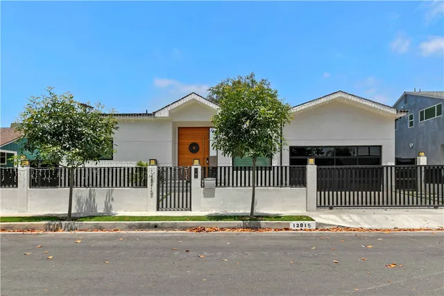a front view of a house with a fence