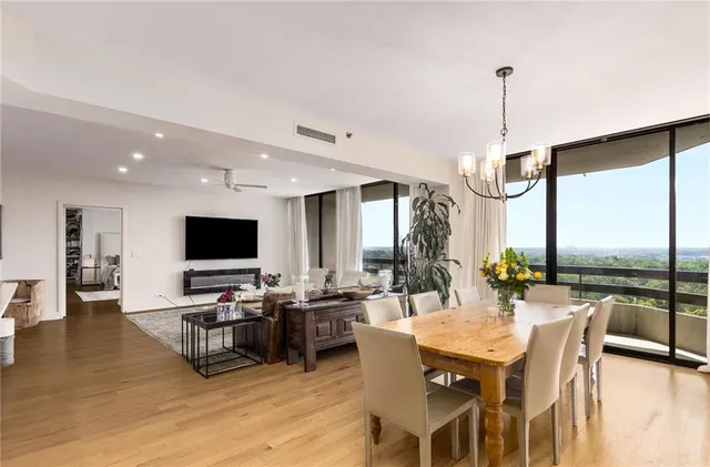 a kitchen with stainless steel appliances kitchen island granite countertop a sink and cabinets