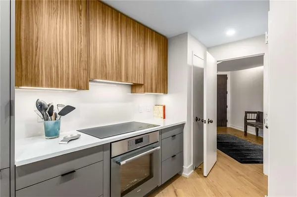 a kitchen with a sink cabinets and refrigerator