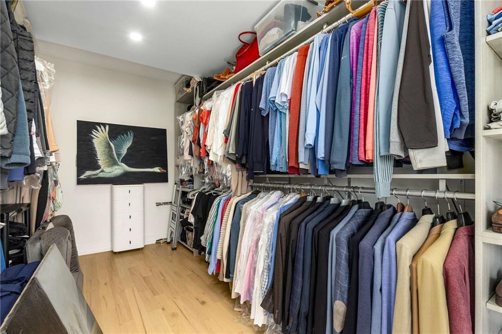 2660 Peachtree Road Northwest, Unit 18H Atlanta, GA 30305 - Photo 24 of 61 a view of walk in closet with clothes and shoes