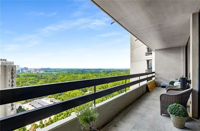 a view of balcony with furniture