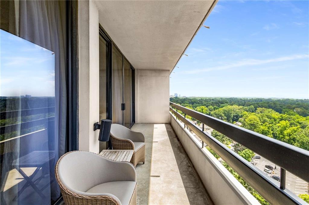 2660 Peachtree Road Northwest, Unit 18H Atlanta, GA 30305 - Photo 38 of 61 a balcony with wooden floor