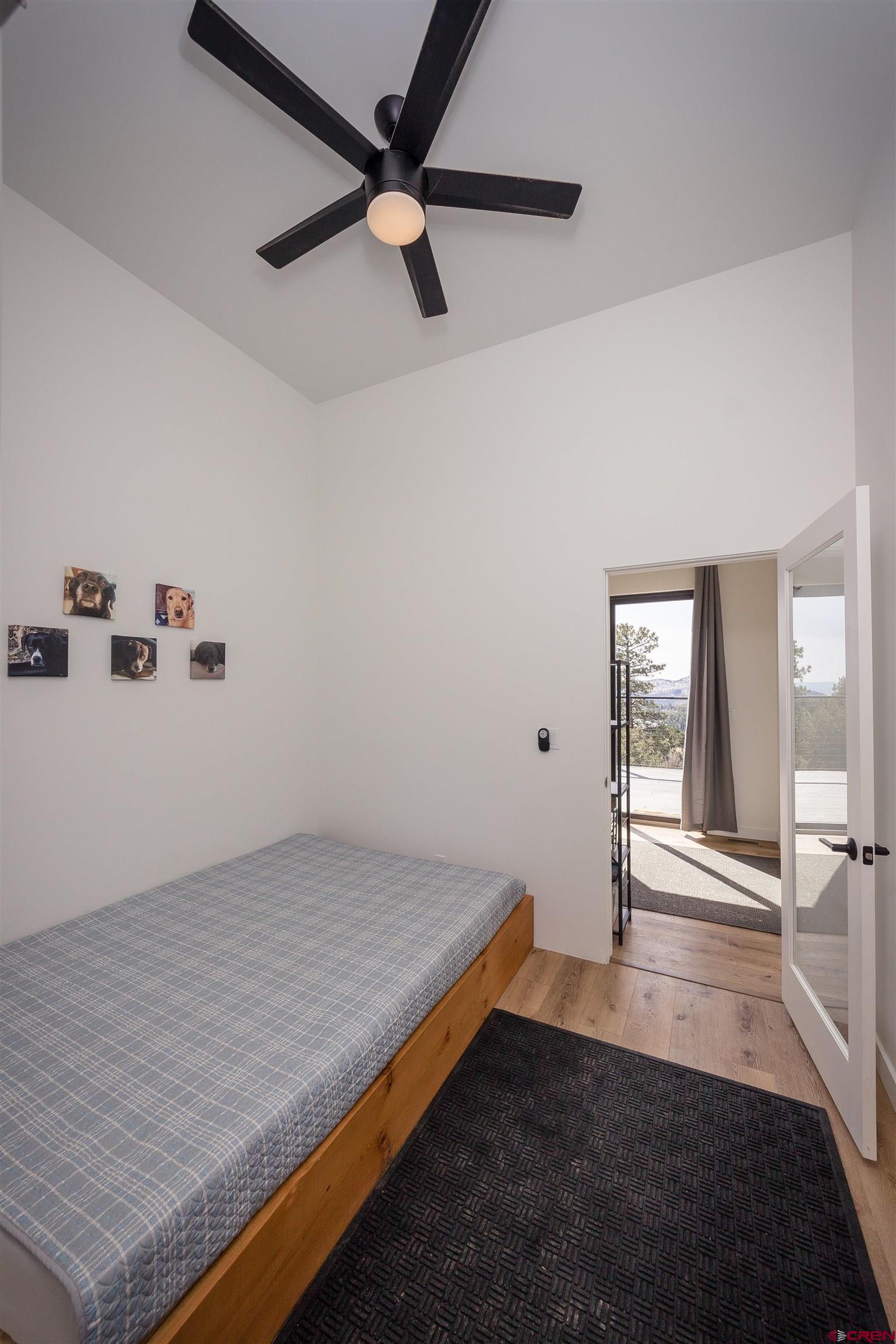405 Far View Road Durango, CO 81303 - Photo 21 of 35 a view of a room with wooden floor and a ceiling fan