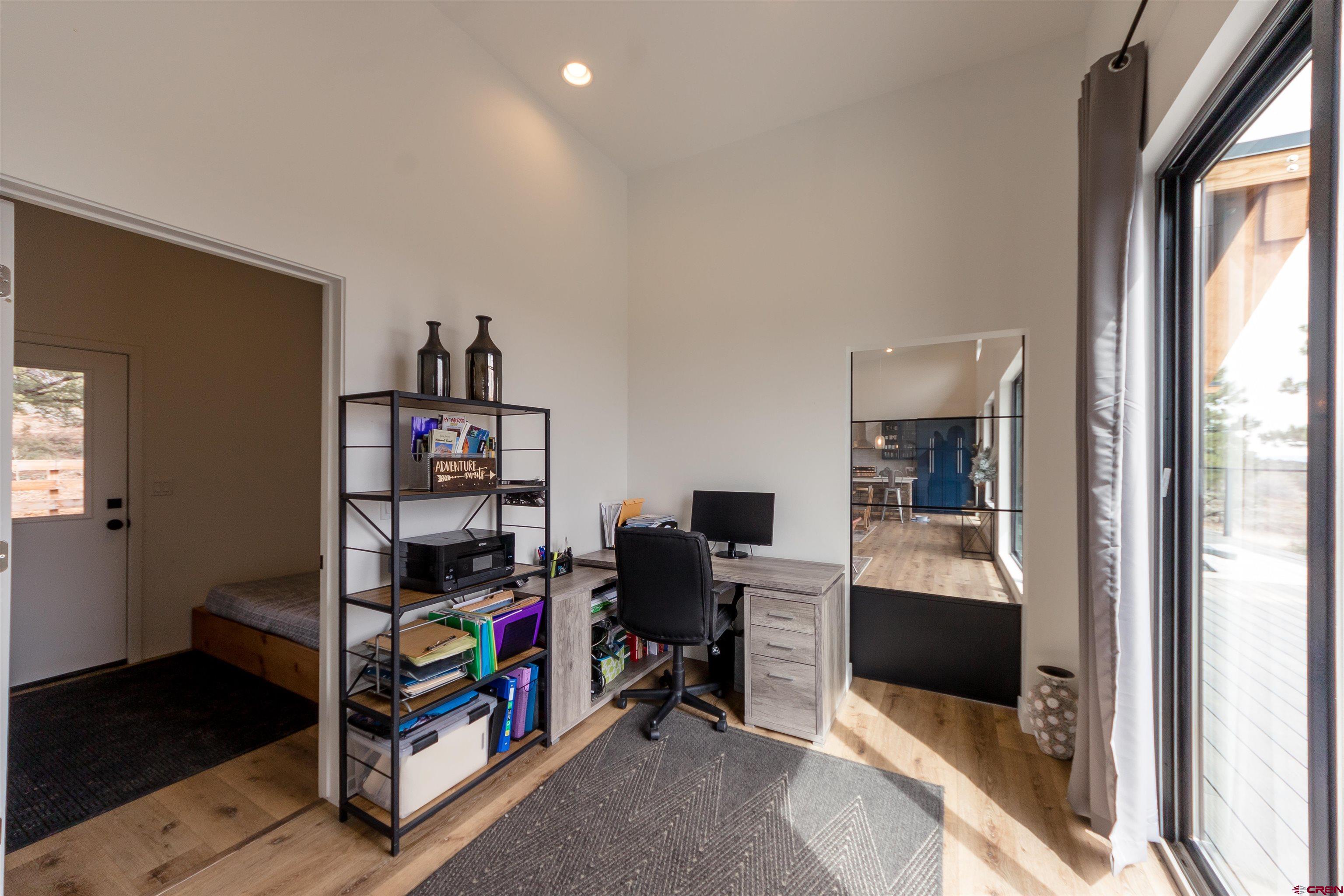 405 Far View Road Durango, CO 81303 - Photo 22 of 35 a view of a workspace with furniture and a window