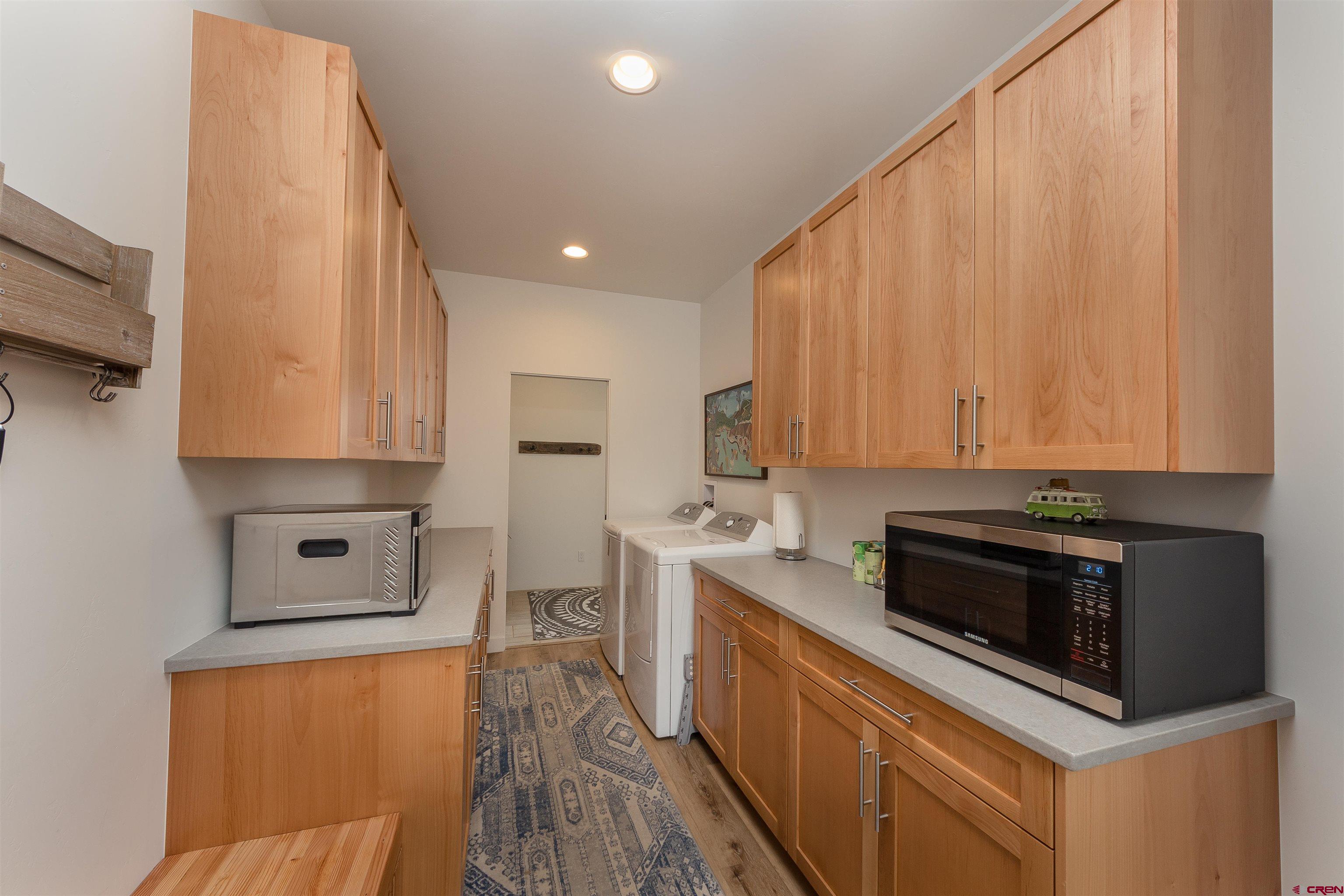 405 Far View Road Durango, CO 81303 - Photo 23 of 35 a kitchen with stainless steel appliances a stove a microwave a sink and cabinets