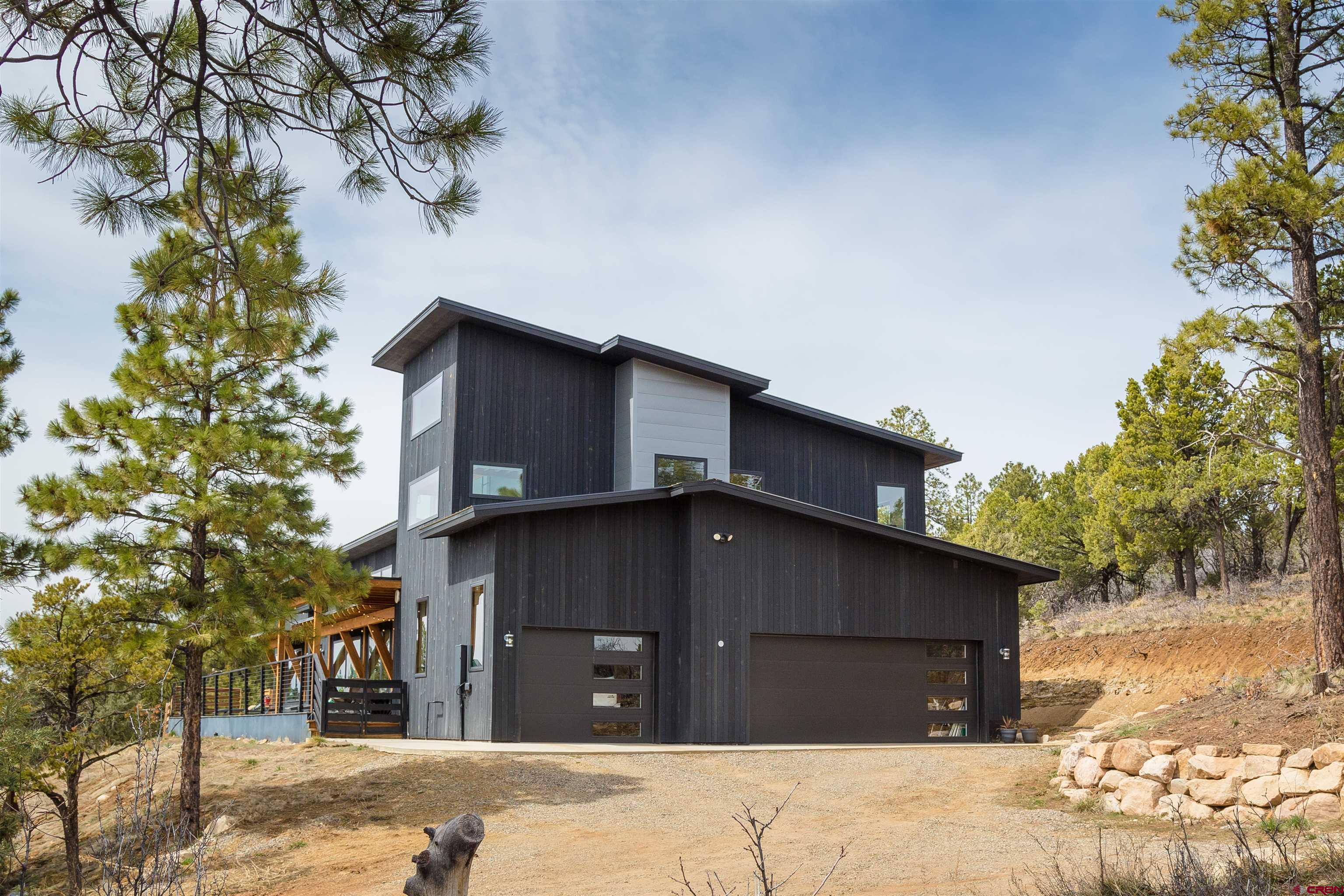 405 Far View Road Durango, CO 81303 - Photo 4 of 35 a house with trees in the background