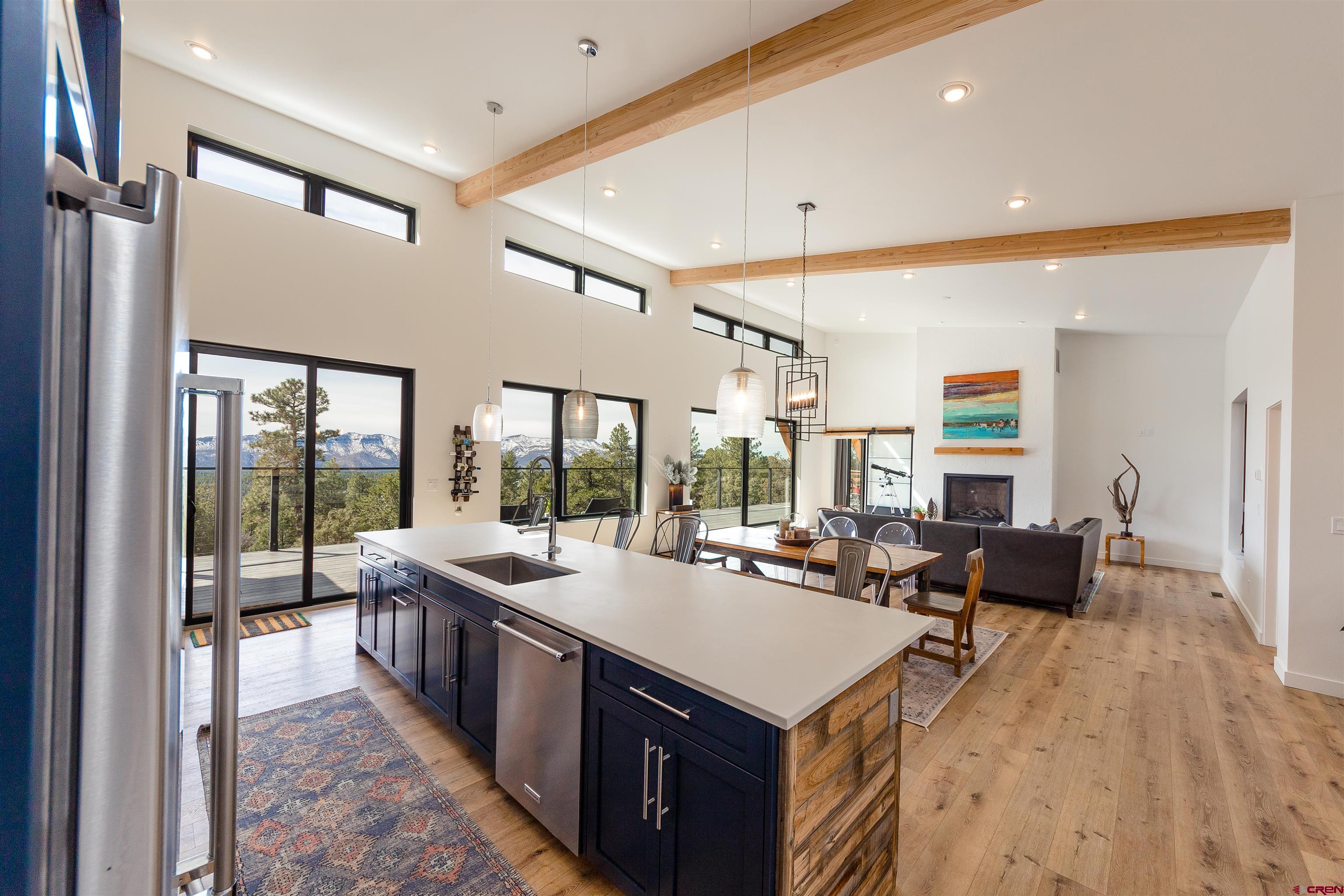 405 Far View Road Durango, CO 81303 - Photo 8 of 35 a large kitchen with kitchen island a large window in it
