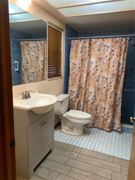 5140 Courtland Road Spring Hill, FL 34608 - Photo 12 of 20 a bathroom with a sink toilet and shower