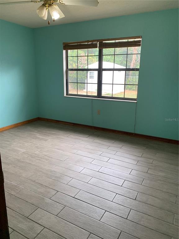 5140 Courtland Road Spring Hill, FL 34608 - Photo 13 of 20 a view of an empty room with a window