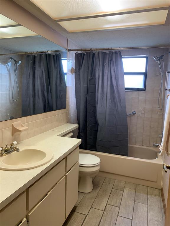 5140 Courtland Road Spring Hill, FL 34608 - Photo 15 of 20 a bathroom with a sink toilet and shower