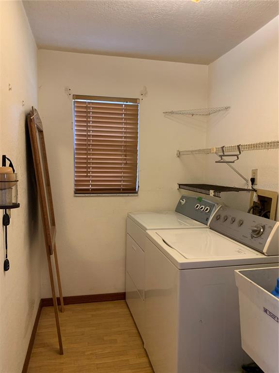 5140 Courtland Road Spring Hill, FL 34608 - Photo 16 of 20 a utility room with dryer and washer