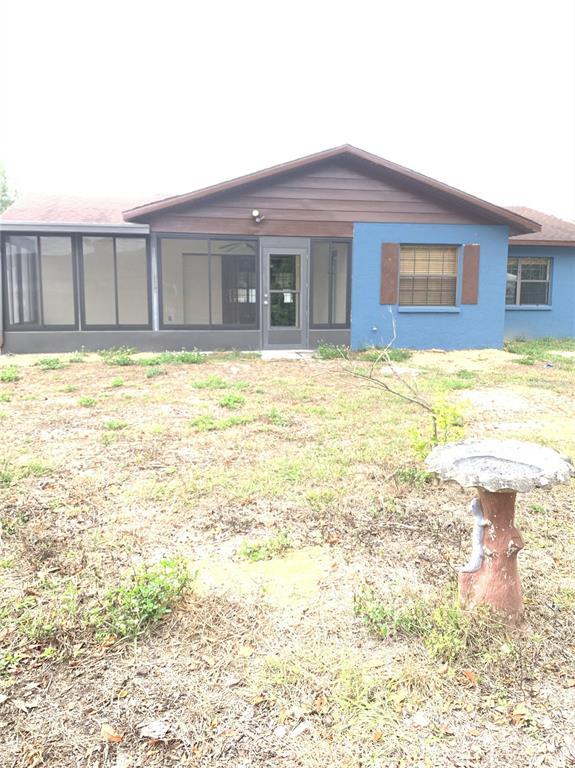5140 Courtland Road Spring Hill, FL 34608 - Photo 19 of 20 a view of a house with a swimming pool