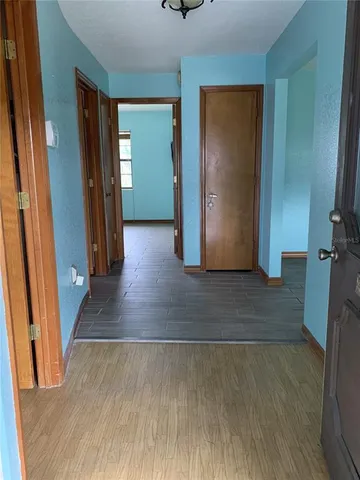 wooden floor in a hall with an entryway