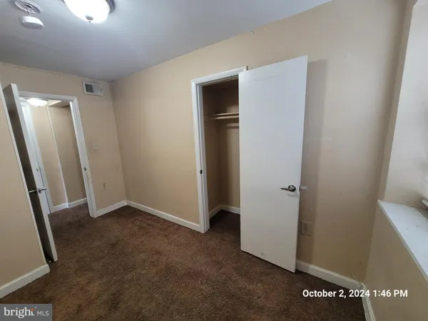a kitchen with a stove a sink and a microwave