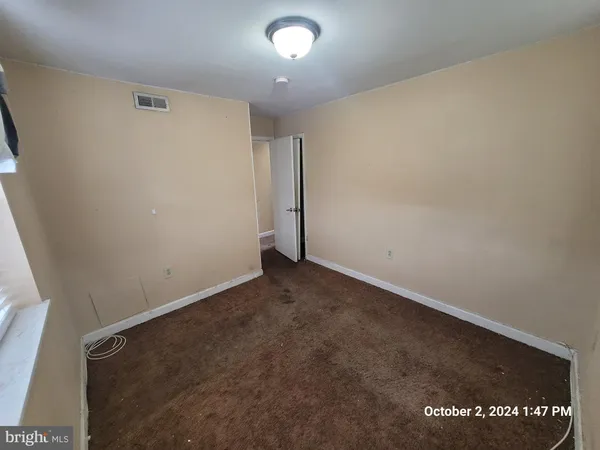 a view of wooden floor and windows in a room