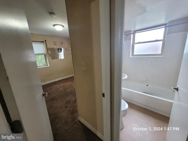 a bathroom with sink and mirror