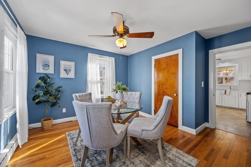 15 Sumner Road Salem, MA 01970 - Photo 10 of 26 a dining room with furniture potted plants and wooden floor