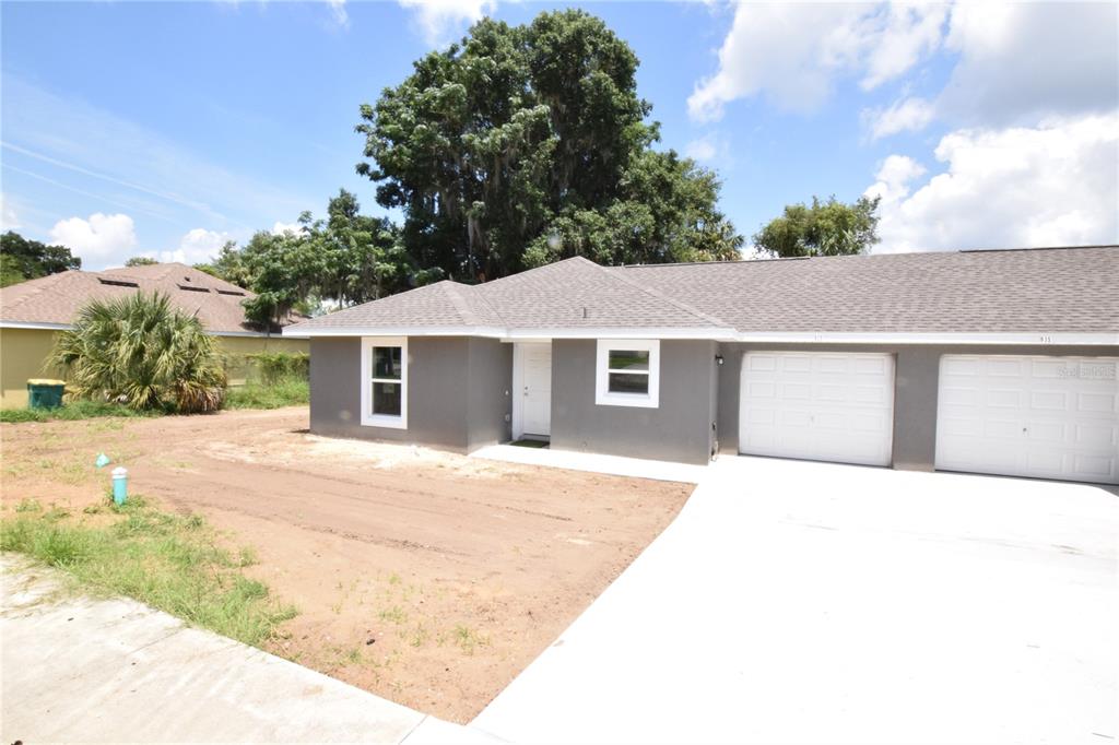 935 East McDonald Avenue Eustis, FL 32726 - Photo 1 of 12 a house with trees in the background