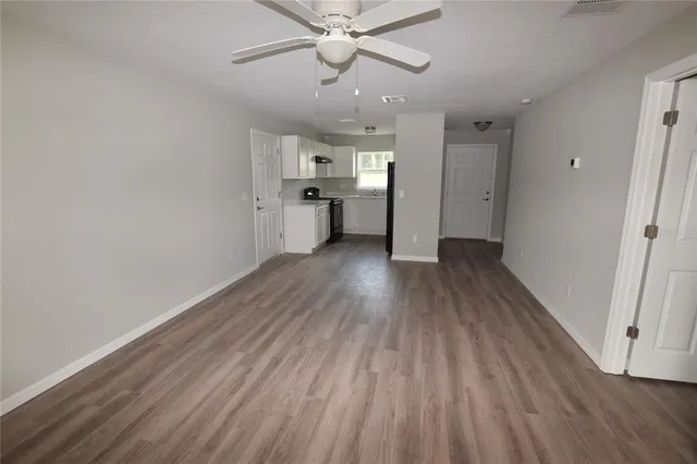 a kitchen with a sink stove and microwave