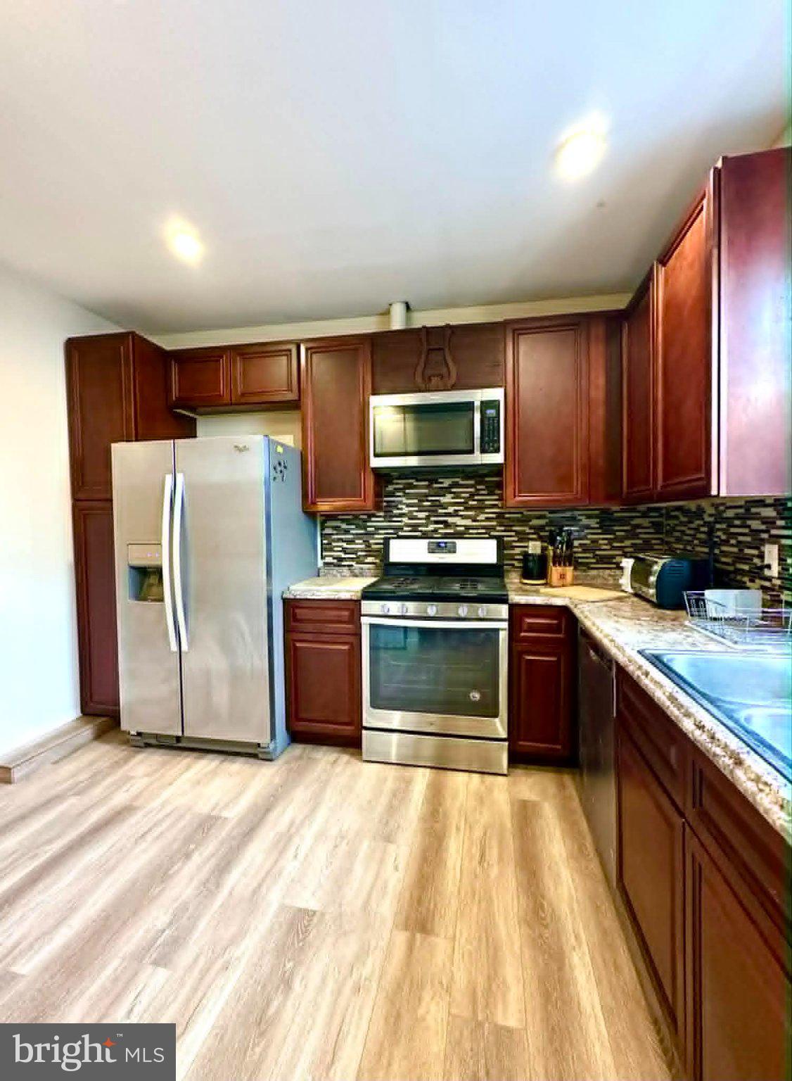 1209 Peters Street Philadelphia, PA 19147 - Photo 4 of 13 Modern kitchen with rich wood tones.