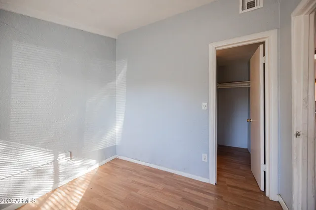 a view of hallway with wooden floor