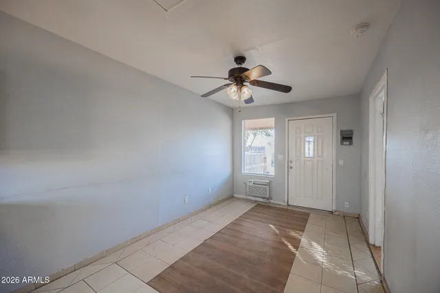 a view of an empty room with a window