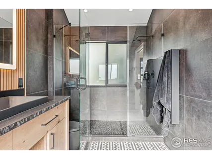 a bathroom with a bathtub and a window