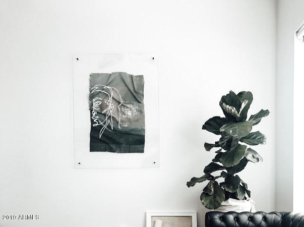 1130 North 2nd Street, Unit 306 Phoenix, AZ 85004 - Photo 17 of 19 a vase of flowers sitting on a table