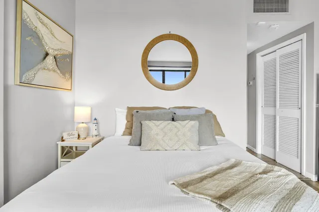 a living room with furniture a large window and a flat screen tv