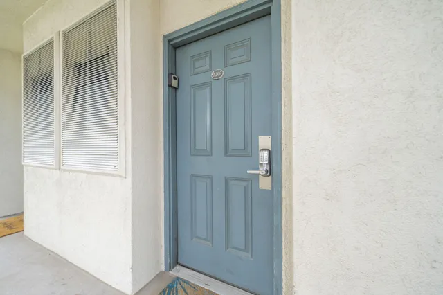 a hallway with a sink and cabinets