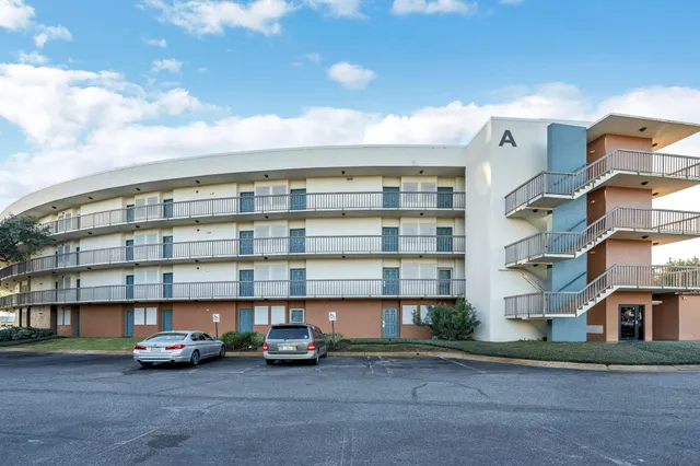 a view of swimming pool with outdoor seating and lake