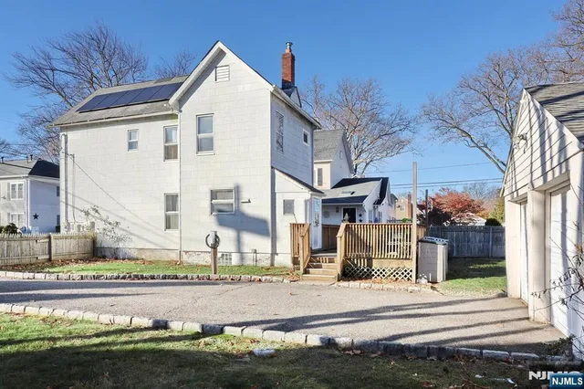 a view of a wooden deck with a yard