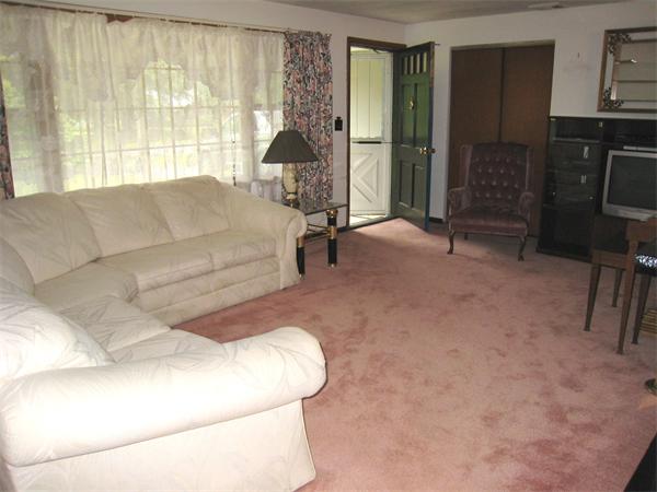 22 Temi Road Chelmsford, MA 01824 - Photo 3 of 8 a living room with furniture and a window