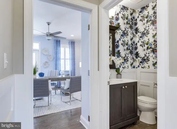 a living room with a toilet and a chandelier