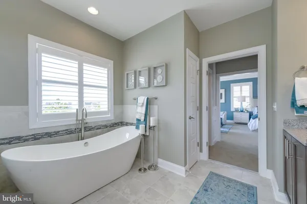 a bathroom with a sink double vanity and a mirror