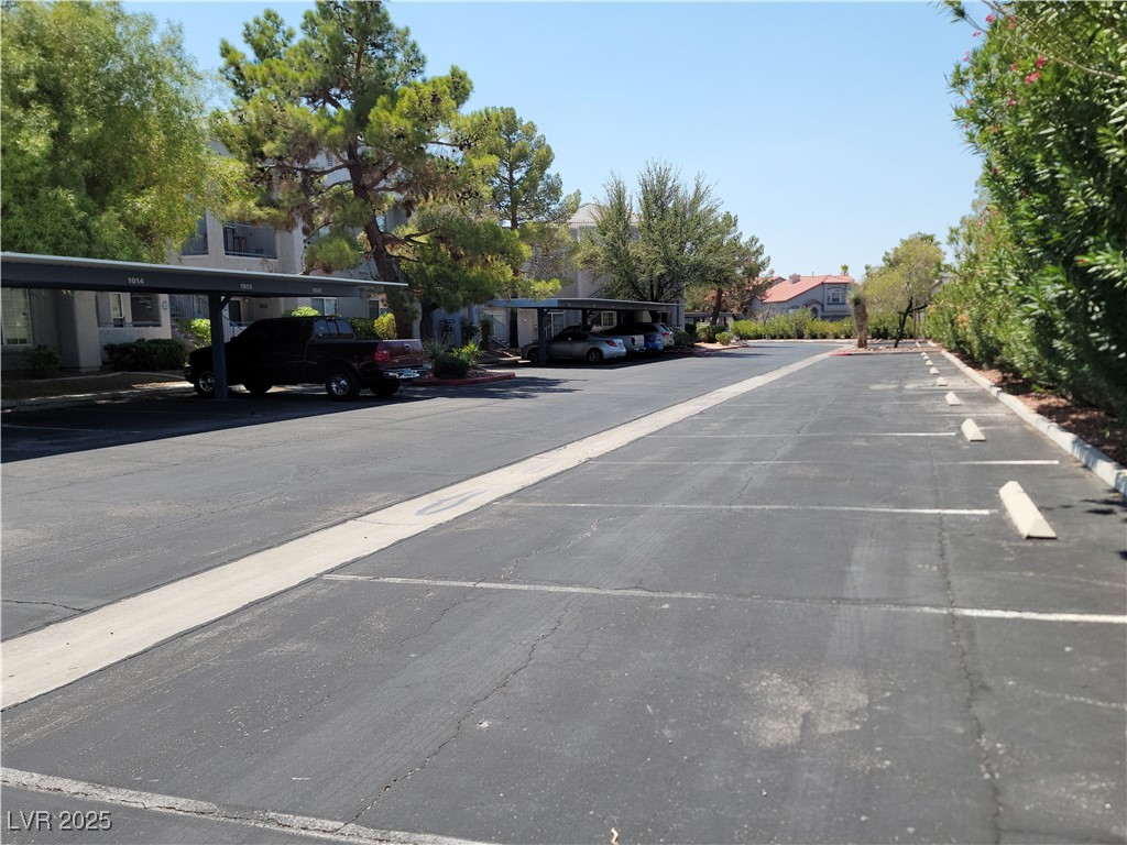 2201 Ramsgate Drive, Unit 923 Henderson, NV 89074 - Photo 27 of 28 View of asphalt road featuring a residential view with plenty of open parking.