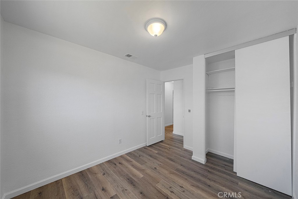 917 Renee Street Redlands, CA 92374 - Photo 21 of 26 One of three bedrooms newly painted, new flooring, lighting.
