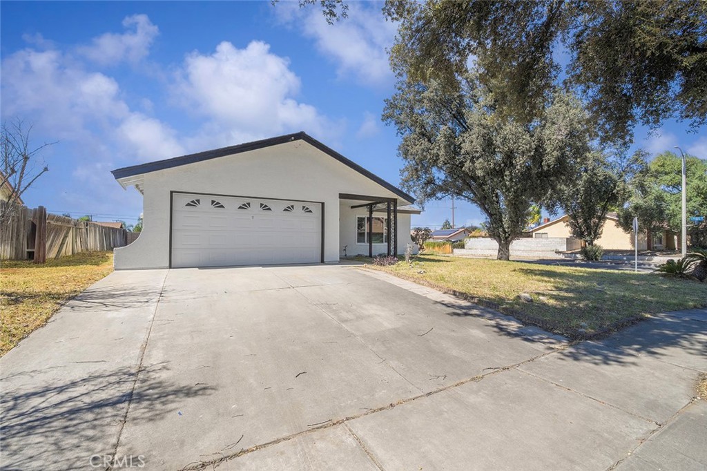 917 Renee Street Redlands, CA 92374 - Photo 25 of 26 Room to park two outside of the 2 car garage. Newly painted home outside and inside.