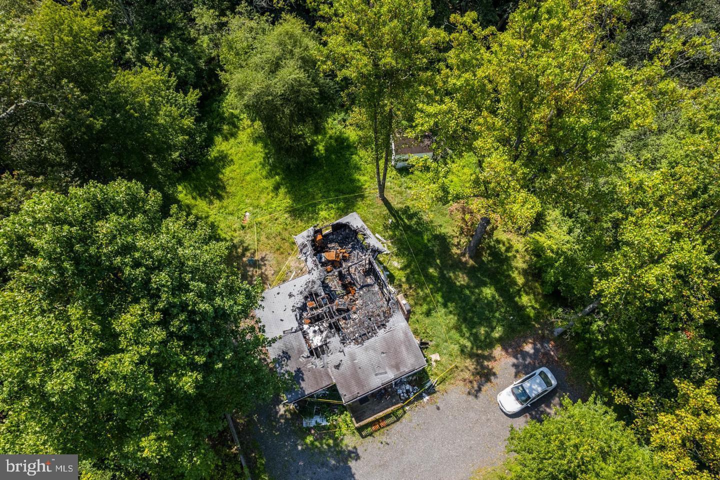 8280 Elvaton Road Millersville, MD 21108 - Photo 4 of 6 an aerial view of a house with a yard and large trees