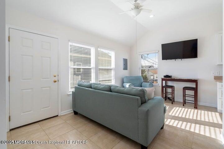 109 West Pompano Way Lavallette, NJ 08735 - Photo 4 of 18 a living room with furniture and a flat screen tv