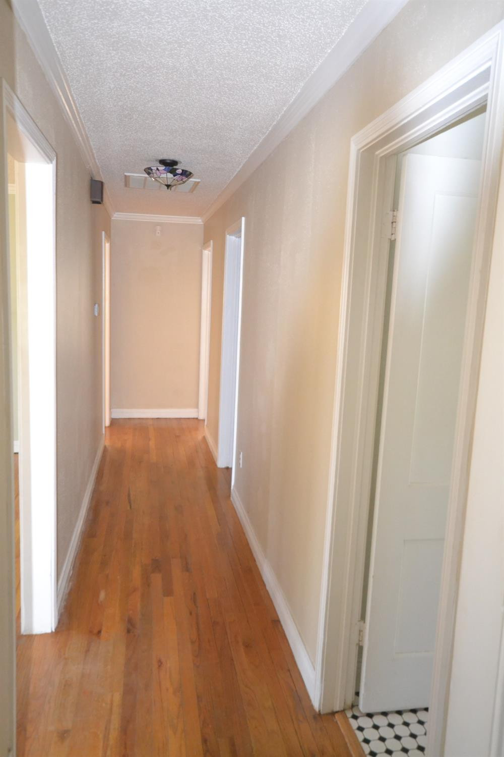 2611 31st Street Lubbock, TX 79410 - Photo 11 of 15 a view of hallway with wooden floor