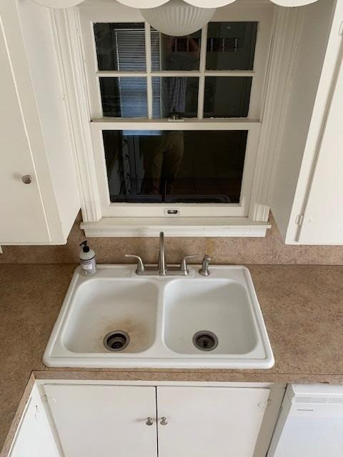 2611 31st Street Lubbock, TX 79410 - Photo 14 of 15 a bathroom with a sink and a mirror