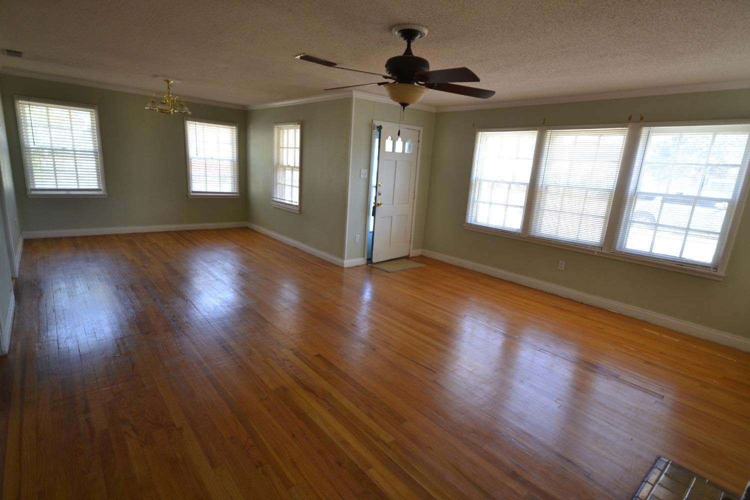 2611 31st Street Lubbock, TX 79410 - Photo 15 of 15 a view of an empty room with wooden floor and a window