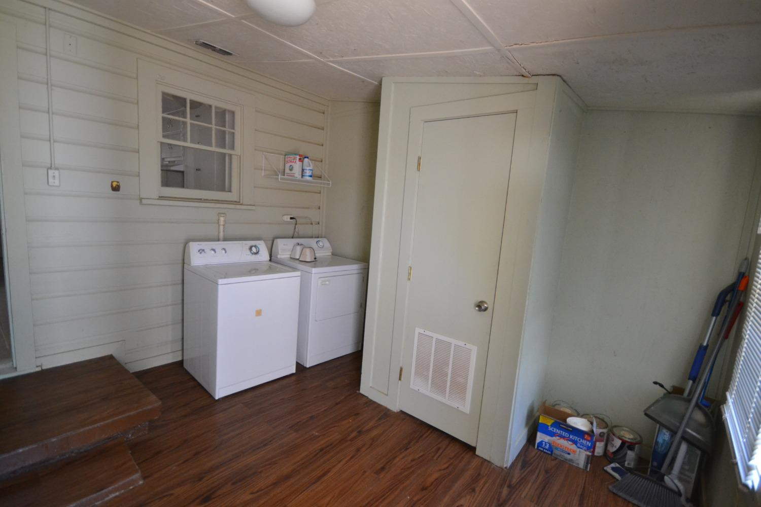 2611 31st Street Lubbock, TX 79410 - Photo 6 of 15 a view of a storage & utility room with wooden floor