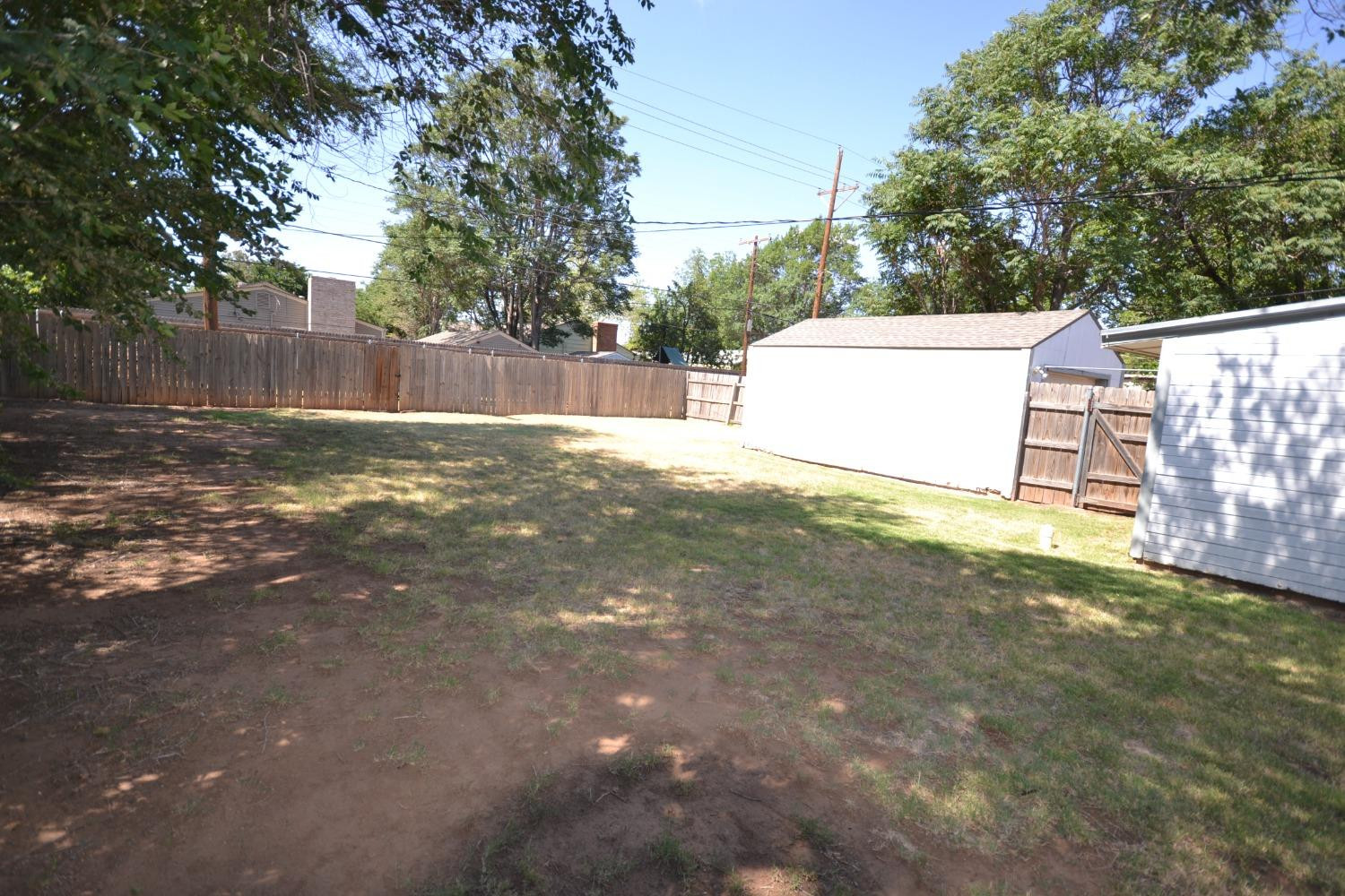 2611 31st Street Lubbock, TX 79410 - Photo 7 of 15 a view of a yard with a house