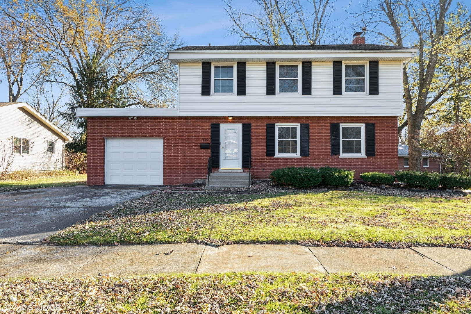 939 Maple Road Flossmoor, IL 60422 - Photo 1 of 23 a front view of a house with a yard and garage