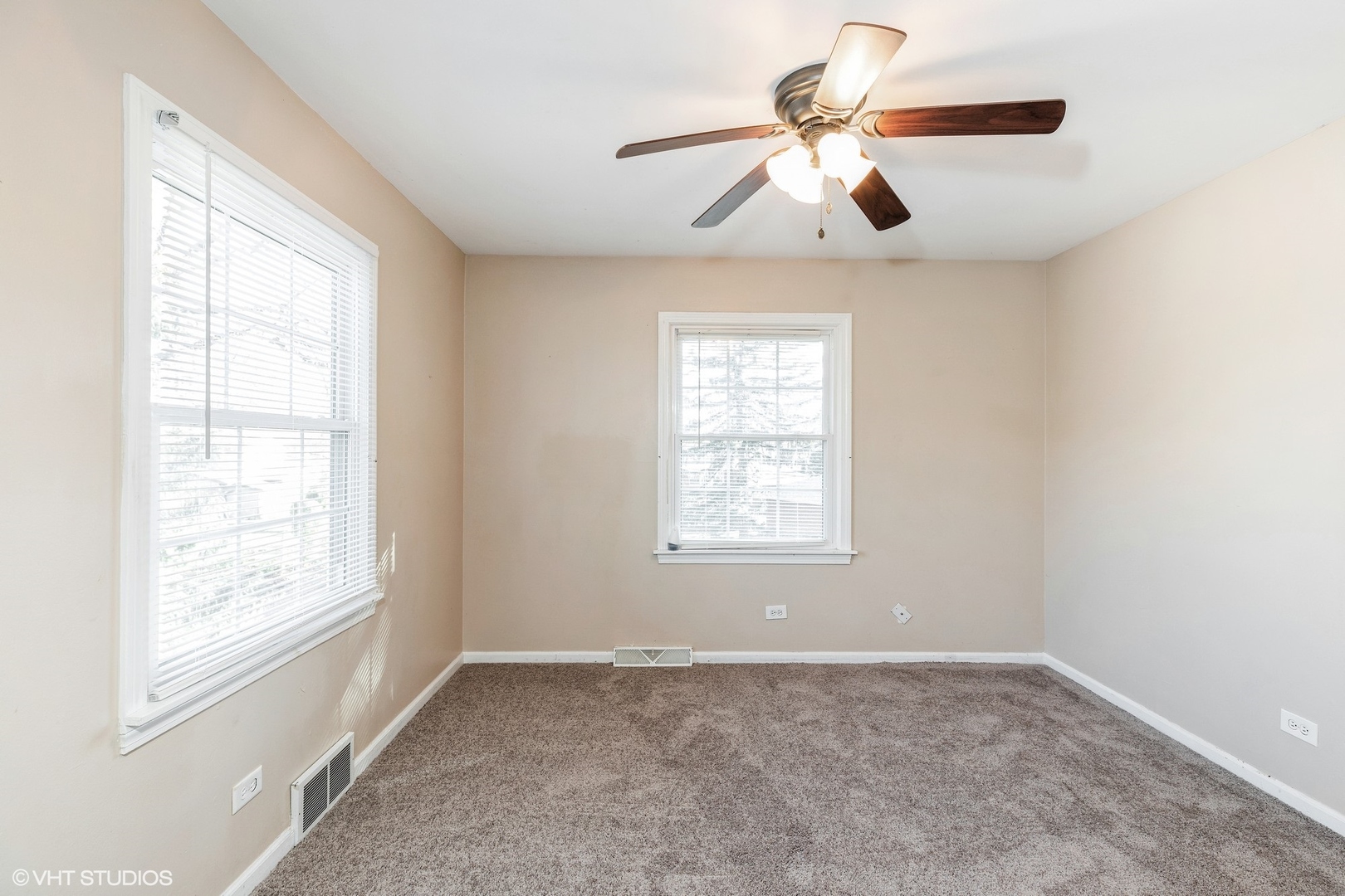 939 Maple Road Flossmoor, IL 60422 - Photo 12 of 23 an empty room with windows and fan